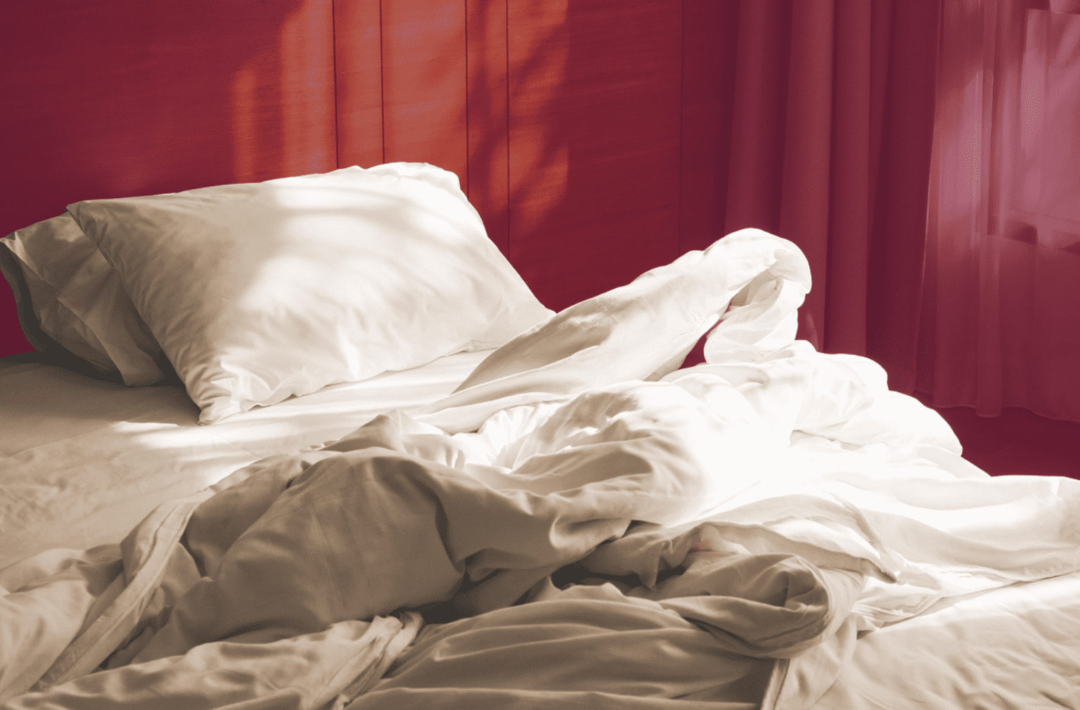 Unmade comfortable bed
